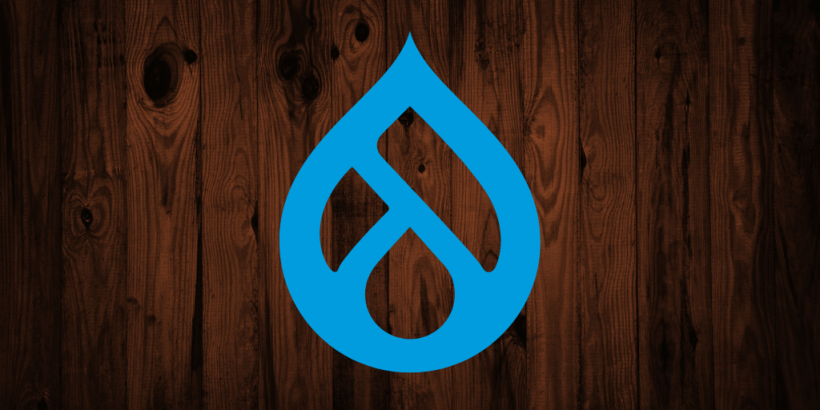 Drupal logo on dark wooden background
